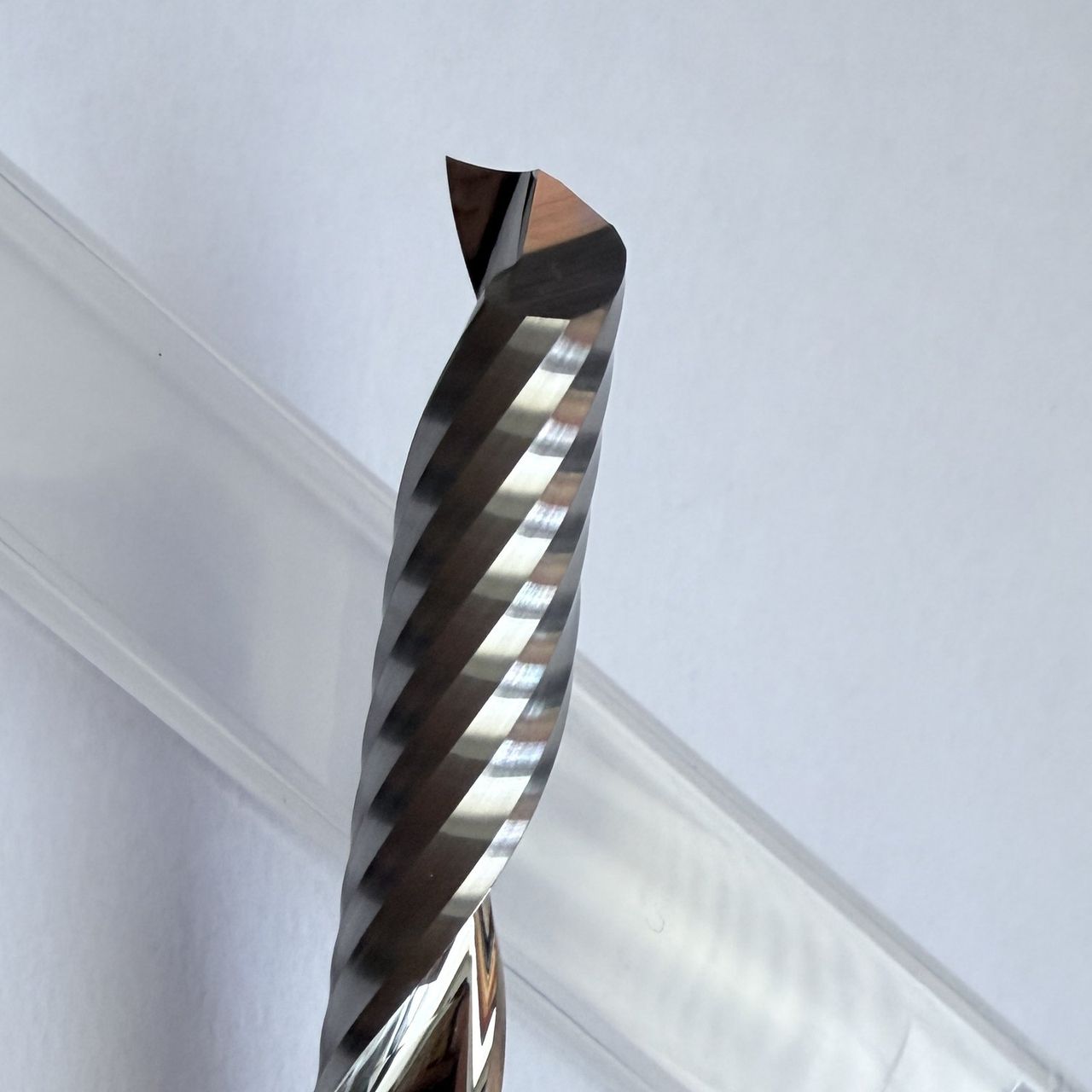 Single-flute carbide end mill with a polished flute
