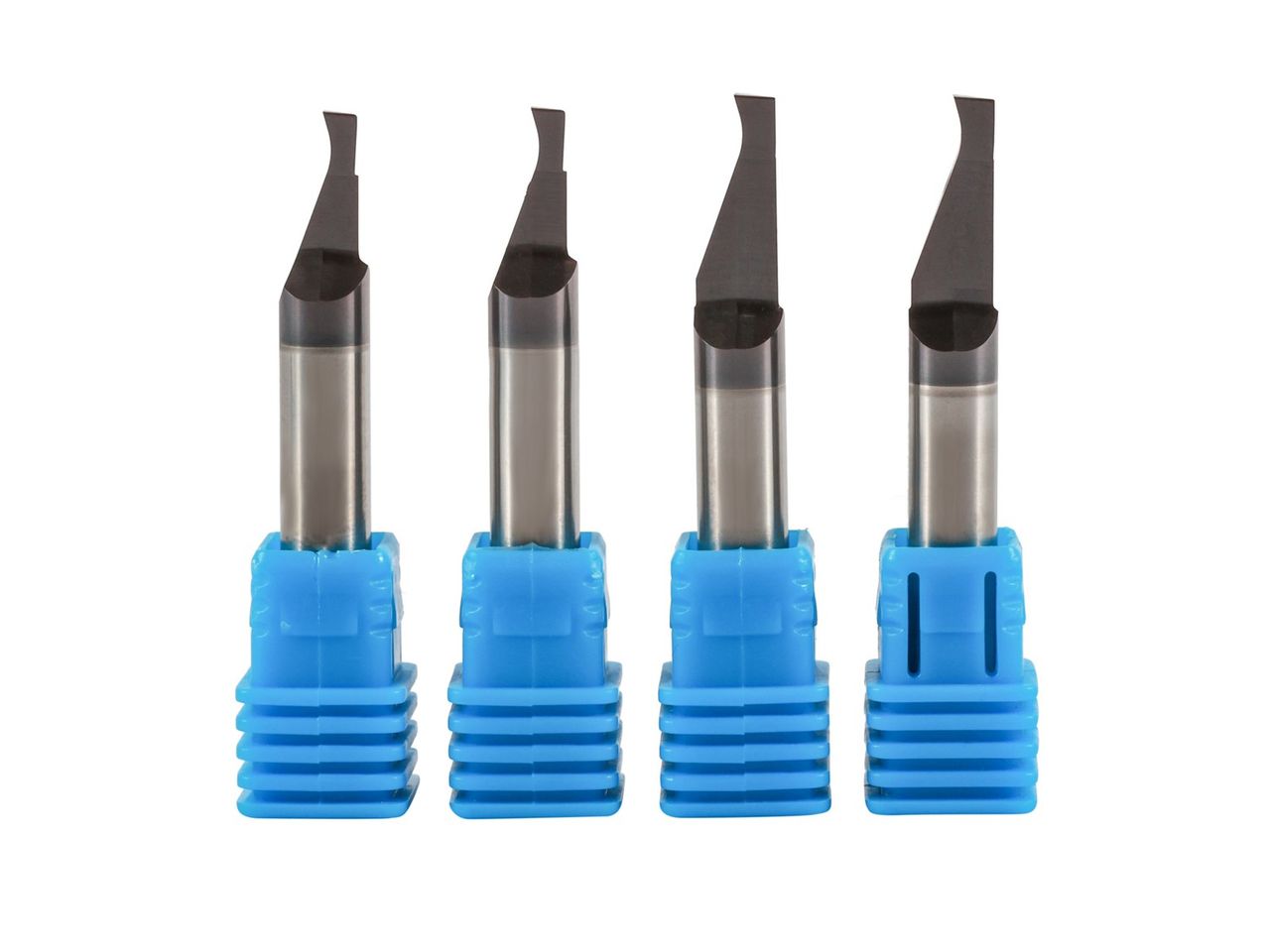 Four boring tools standing in blue holders