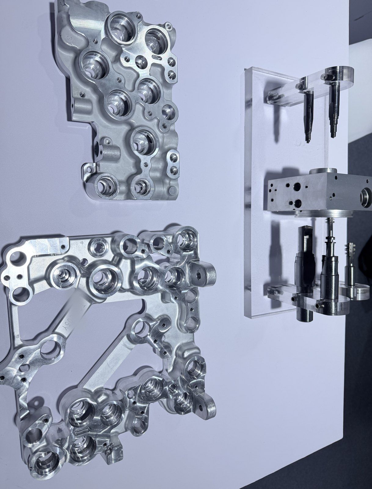 Machined aluminium parts with step tools on a stand
