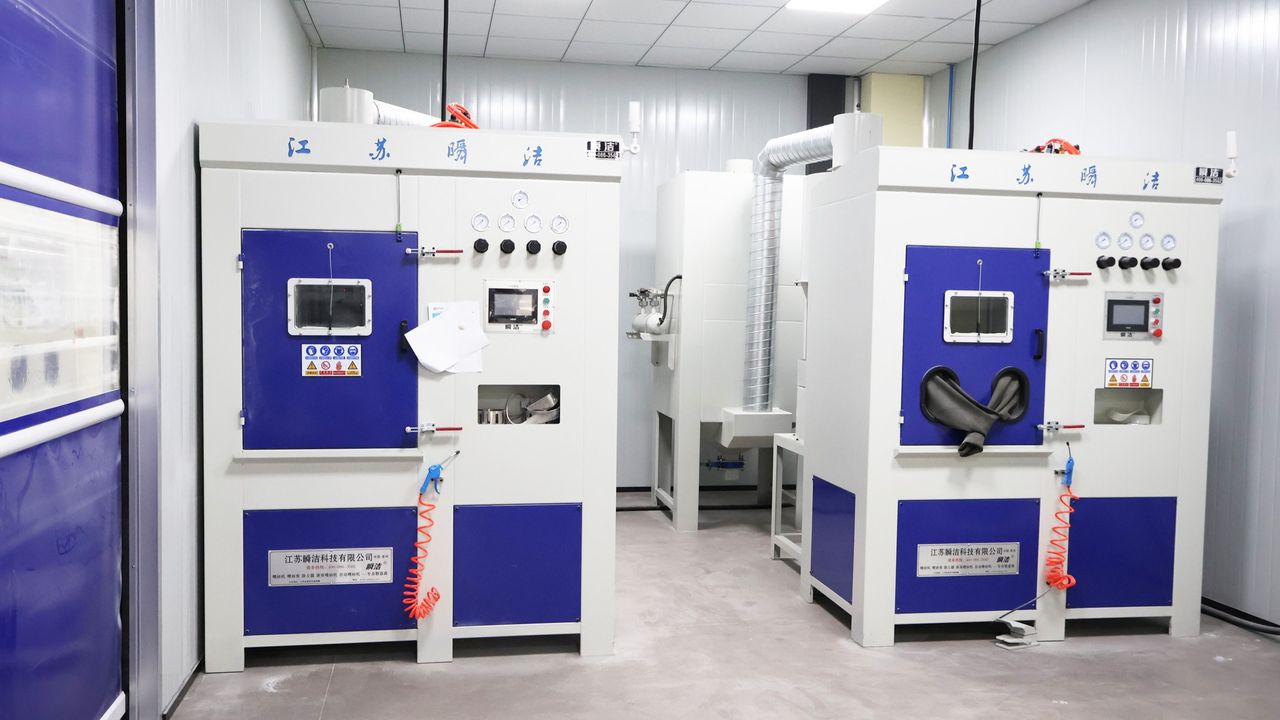 Enclosed production equipment with control panels